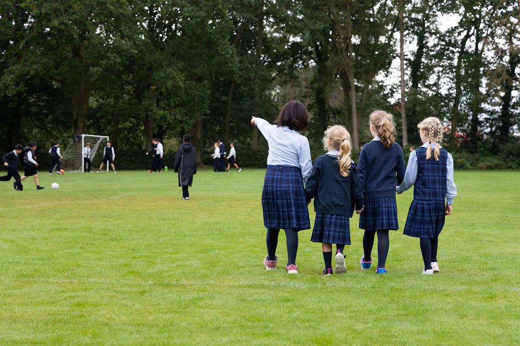 A group of Horris Hill School pupils walk across the school grounds